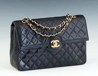 Vintage Chanel Single Flap Shoulder Bag, in black quilted calf leather with gold hardware, opening to a maroon calf leather lined interior , Serial # 