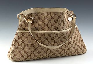 Gucci Eclipse Tote Shoulder Bag, in brown monogram canvas with ivory leather accents and gold hardware, opening to a dark brown canvas lined interior 