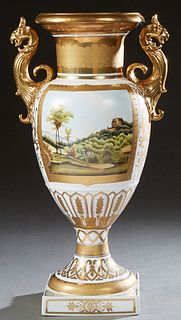 Large Royal Vienna Style Porcelain Baluster Vase, 20th c., with an everted gilt decorated rim over applied gilt gryphon handles, above two scenic land