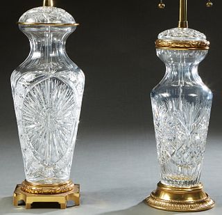 Two Waterford Brass Mounted Covered Crystal Table Lamps, 20th c., one with a circular brass base, H.- 18 in., Dia- 7 in.; the other with a shaped squa