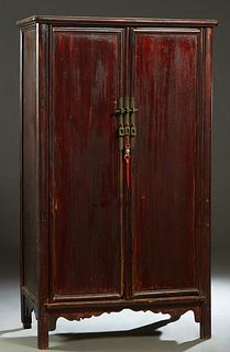 Rare Chinese Ming Style Carved Cedar Armoire, 18th c., the stepped rounded corner edge and side crown over double doors with brass locks, opening to a