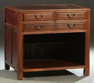 Chinese Carved Elm Sideboard, late 19th c., the dished top over two fielded panel frieze drawers above a long drawer and open storage, flanked by fiel
