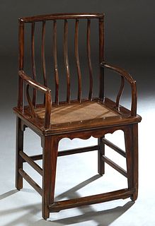 Pair of Ming-Style Carved Elm Armchairs, 20th c., the curved spindled back to curved arms over rattan seats, joined by rectangular stretchers, H.- 40 