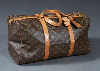 Louis Vuitton Sac Souple 45 Travel Bag, in a monogram coated canvas, with vachetta leather accents and golden brass hardware, in a brown canvas lined 