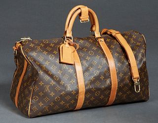 Louis Vuitton Keepall Bandouliere 50 Travel Bag, in a monogram coated canvas, with vachetta leather accents, and golden brass hardware, with a brown c