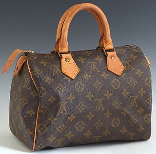 Louis Vuitton Speedy 25 Handbag, in a brown monogram coated canvas, with vachetta leather accents and golden brass hardware, H.- 7 1/2 in., W.- 10 in.