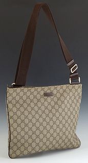 Gucci Messenger Bag, in beige supreme coated canvas with brown canvas accents and silver hardware, opening to a dark brown canvas lined interior with 