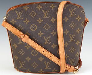 Louis Vuitton Drouot Shoulder Bag, in a brown monogram coated canvas, with vachetta leather accents and golden brass hardware, opening to leather inte