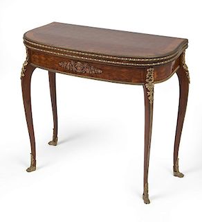 A French gilt bronze-mounted flip-top game table