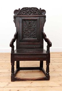 An oak wainscot armchair,