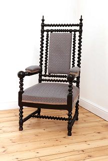 A Victorian ebonised barley twist armchair,
