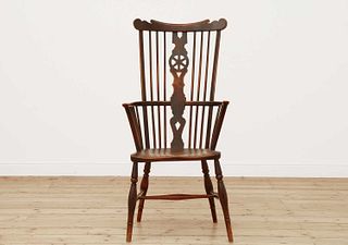 A George III fruitwood and elm high comb back Windsor chair,