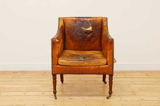 A Regency buttoned-leather upholstered library armchair,