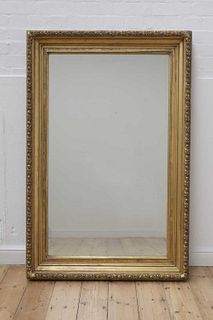 A carved giltwood rectangular mirror,