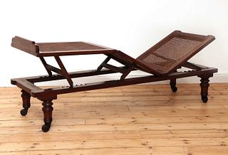 A Victorian caned campaign daybed,