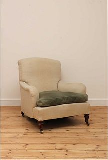 An armchair in the manner of Howard & Sons,