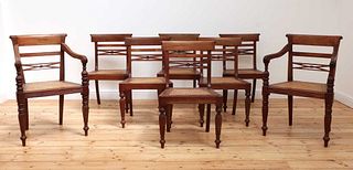 A matched set of eight Anglo-Indian Regency-style teak dining chairs