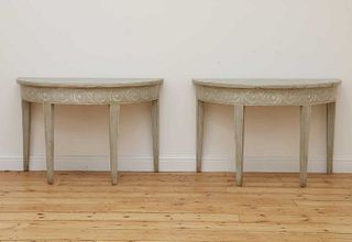 A pair of Swedish Gustavian-style painted demilune side tables,