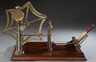 Spinner's Weasel, 19th c., by Goodbrand & Co., Ltd., Manchester, a yarn measuring device, on a mahogany base, said to be the origin of the children's 
