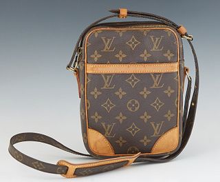 Louis Vuitton Danube Shoulder Bag, in a brown monogram coated canvas, with vachetta leather accents and golden brass hardware, H.- 8 in., W.- 6 in., D