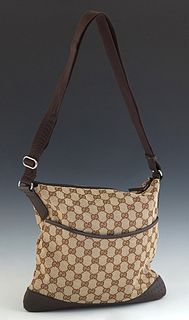 Gucci Medium Messenger Shoulder Bag, in a beige monogram canvas, with dark brown leather and canvas accents, and ruthenium hardware, opening to a brow