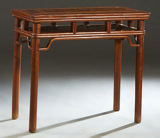 Chinese Carved Elm Side Table, 19th c., Qing dynasty, the rectangular top over a reeded skirt, joined by reeded spindles, to cylindrical legs, a curve