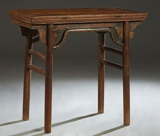 Chinese Ming Dynasty Carved Elm Wine Table, 17th c., the rectangular top over a pierced skirt, on rounded square legs joined by rectangular stretchers