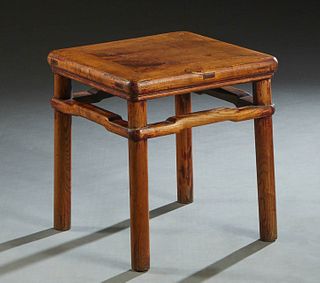 Chinese Qing Era Carved Walnut Side Table, 19th c., the rounded corner and edge top on cylindrical legs, joined by arched square stretchers, H.- 20 in