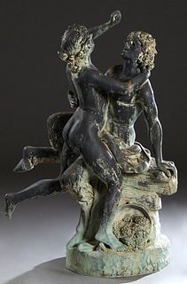 Large Patinated Bronze Erotic Figural Garden Group, 20th c., of a seated Satyr and a nude woman, on an integral circular base with a spilled bowl of g