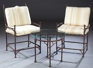 Three Piece Cast Iron Garden Set, 20th c., consisting of two armchairs, the backs with naturalistic branch supports, over a slatted seat, with cloth b