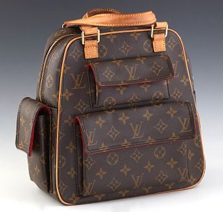 Louis Vuitton Excentri-Cite Handbag, in brown monogram coated canvas with vachetta leather straps and golden brass hardware, H.- 10 in., W.- 9 1/2 in.