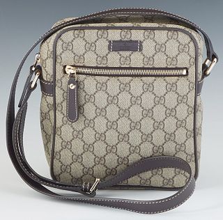 Gucci Messenger Bag, in supreme beige coated canvas with grey leather accents and silver hardware, H.- 8 3/4 in., W.- 7 1/2 in.
