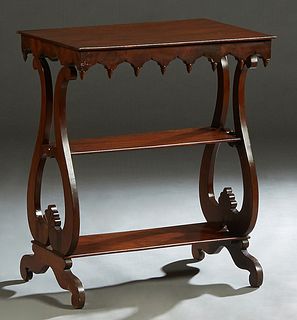 American Gothic Carved Mahogany Two Tier Side Table, late 19th c., in the manner of J. and J. W. Meeks, the rectangular top over a scalloped skirt wit