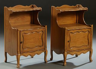 Pair of Louis XV Style Carved Mahogany Nightstands, 20th c., with a 3/4 galleried upper half shelf, over a galleried lower shelf above a fielded panel