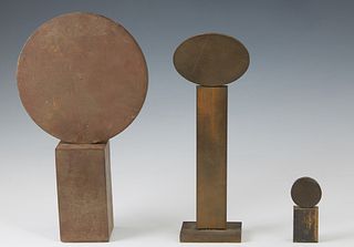 Peter Lobello (1935-2007, American) Three Geometric Sculptures, 1992, of orbs on columns, the largest of iron, the two smaller examples of bronze, all