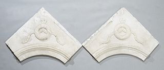 Pair of Carved White Marble Architectural Fragments, 19th c., possibly interior fireplace mantel corners, with relief wreath and garland decoration, H