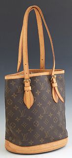 Louis Vuitton Bucket Shoulder Bag, in a brown monogram coated canvas, with vachetta leather and golden brass hardware, with a beige canvas lined inter