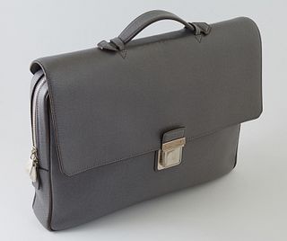 Louis Vuitton Grey Taiga Leather PM Vassili Handbag, with silver hardware and a silver button clasp, the main zip compartment opening to a dark grey c
