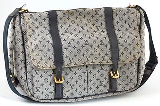 Louis Vuitton Sac Maman Monogram Navy Blue Canvas Shoulder Bag, with golden brass decoration, the buckle closure opening to two side pockets, the inte