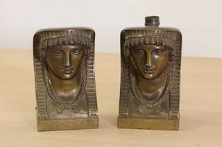 A pair of Egyptian-style bronze furniture mounts,