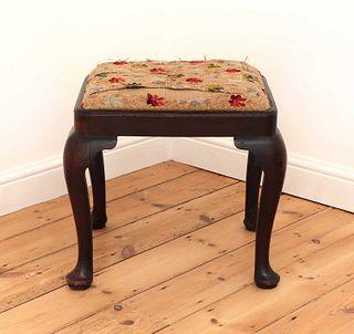 A George III mahogany stool,