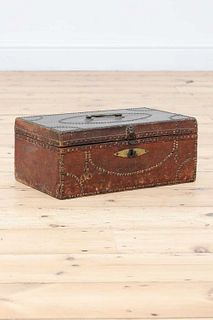 A red leather and studded deeds box,