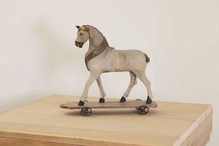 A folk art pull-along horse,