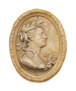 A plaster roundel depicting Demeter,