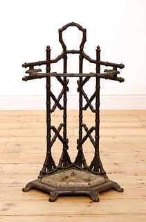 A faux bois cast iron corner stick stand,