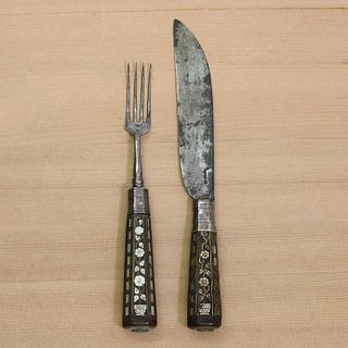A steel knife and fork,