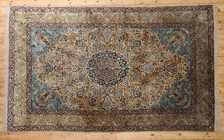 A Persian silk carpet,