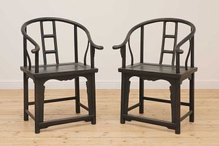 A pair of Chinese-style ebonised softwood armchairs,
