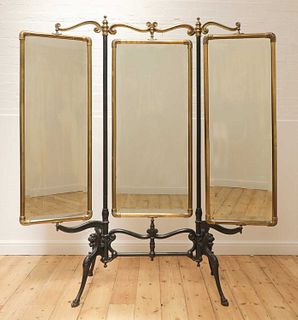 A cast iron and brass triptych cheval mirror,