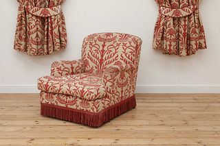 An armchair in the manner of Howard & Sons,